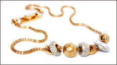 Gold necklace with diamonds on gold beads